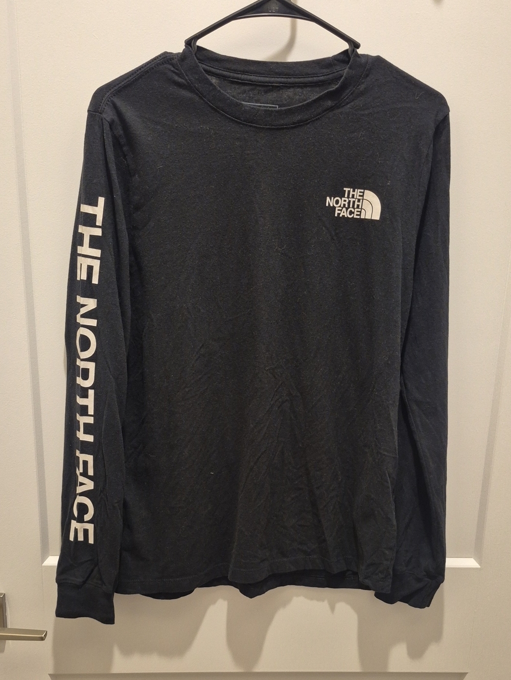 The North Face Black Long Sleeve Logo Tee with White Sleeve Text
